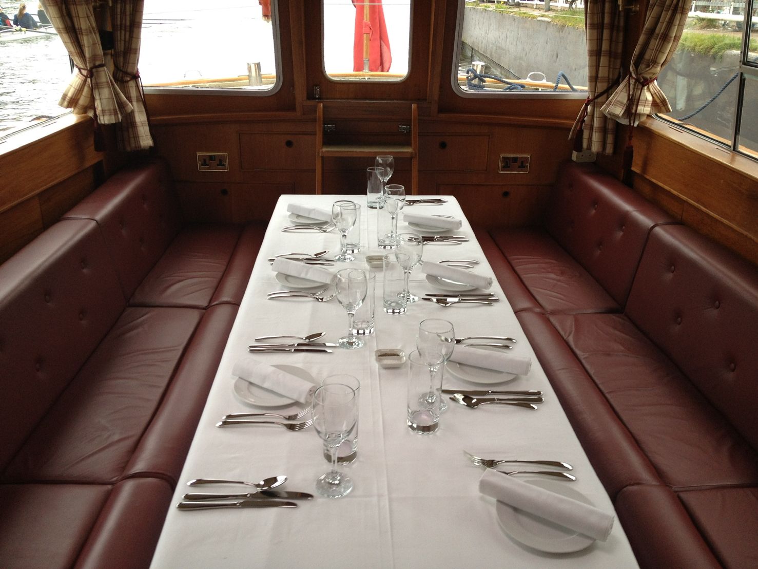 Dining saloon laid for a private dinner aboard the Windrush