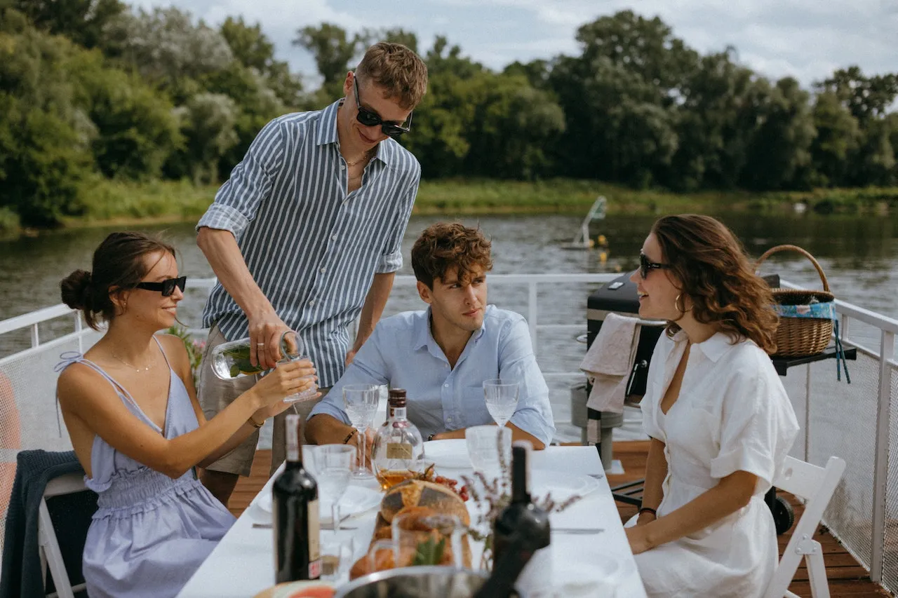 Friends enjoying lunch on a yacht deck